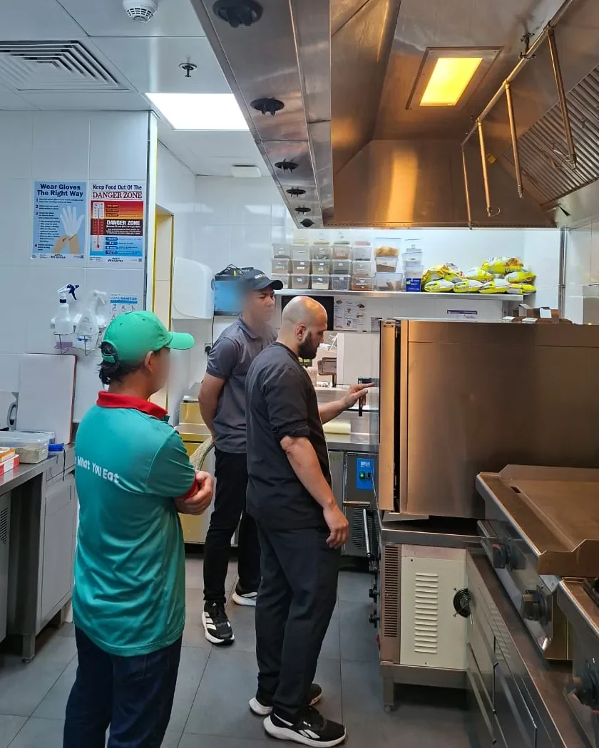 Chef Antonino of The Chef Blade training restaurant kitchen staff on-site in Dubai