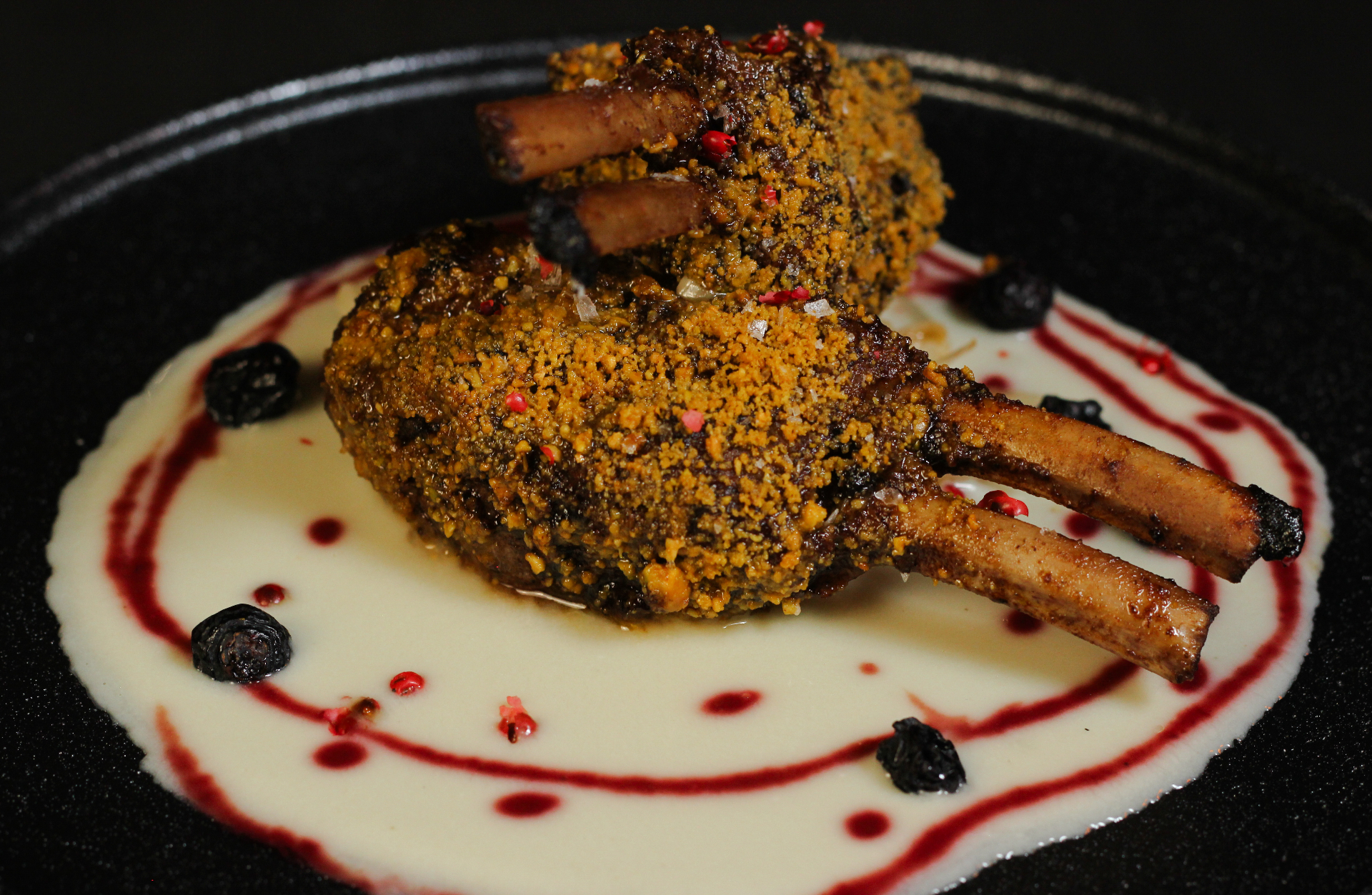 Herb-crusted lamb chops with elegant plating